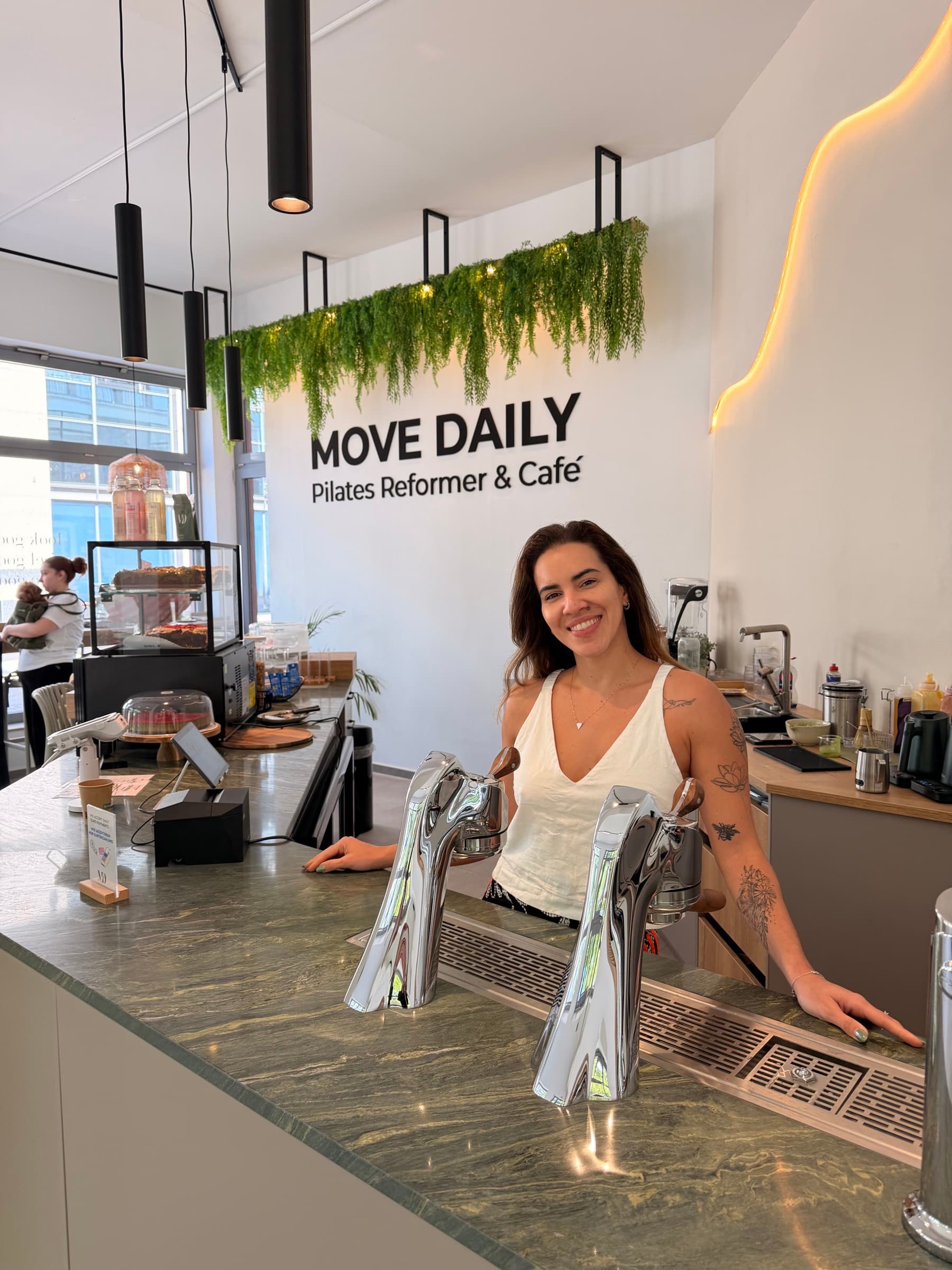 Barista at the Move Daily café counter